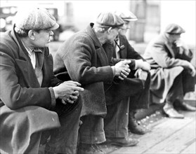 Row of men at the New York City docks out of work during the depression, 1934, Lewis Hine, 1874 -