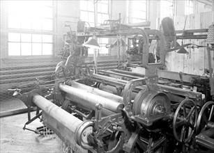 Paterson, New Jersey - Textiles. Idle quilling machines and looms in a cockroach shop. Note