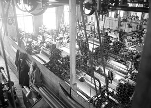 Paterson, New Jersey - Textiles. Idle quilling machines and looms in a cockroach shop, March 1937,