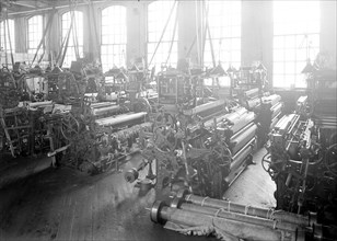 Paterson, New Jersey - Textiles. Idle looms in a cockroach shop. Note the empty beams in the