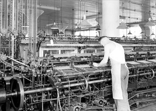 Philadelphia, Pennsylvania - Hosiery. Minnesac Mills. [Man working over long row of machines.],