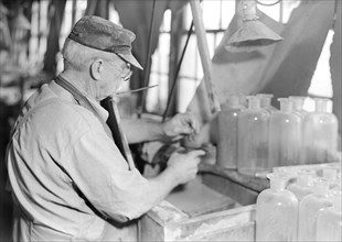Millville, New Jersey - Glass bottles. Stopper-grinder at T. C. Wheaton Co, March 1937, Lewis Hine,