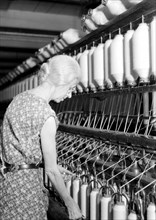 Millville, New Jersey - Textiles. Millville Manufacturing Co. [Lady twisting thread.], 1936, Lewis