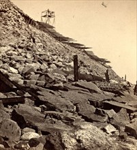 Sea face of Fort Sumpter (i.e. Sumter), shewing (i.e. showing) light house, broken gun, &c Fort