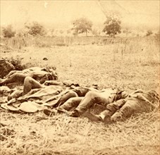 Dead soldiers lying side by side in a field, US, USA, America, Vintage photography