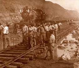 Spanish laborers at work in Culebra Cut and loaded train hauling dirt from canal, US, USA, America,