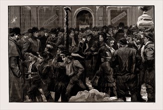 DISTRESS IN LONDON, UK, 1886: UNEMPLOYED WAITING AT A SOUP KITCHEN FOR THE DOORS TO OPEN