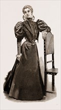 AN INDOOR DRESS, 1897
