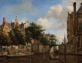 Amsterdam City View with Houses on the Herengracht and the old Haarlemmersluis, The Netherlands,