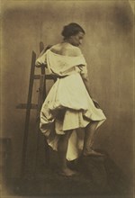 Model in White Dress with Easel