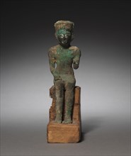 Statuette: Seated Amen-Ra, 715-525 BC. Egypt, Late Period, Dynasty 25-26 (?). Bronze and black