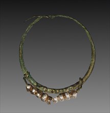 Earring, 30 BC-AD 395. Egypt, Roman Empire. Bronze and glass; diameter: 3.6 cm (1 7/16 in.).