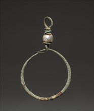 Earring, 2nd-3rd century AD. Egypt, Roman Empire. Bronze and glass; diameter: 3.4 cm (1 5/16 in.);