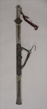 Sword, 1800s. Eastern Tibet. Iron and silver with bone, turquoise, leather and brass; overall: 79.4