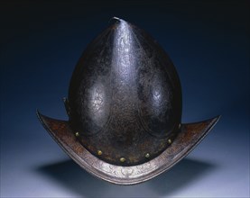 Peaked Morion, c. 1580-1590. North Italy, Milan?, 16th century. Etched russet steel with traces of