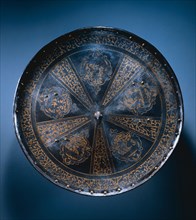 Rondache (Round Shield), c. 1570. Italy, Milan, 16th century. Etched and gilded steel with brass