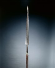 Partisan, c. 1600-1620. Italy, early 17th Century. Steel; rectangular wood haft with planed