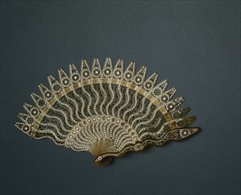Brisé Fan, c. 1825. France (?), 19th century. Horn, silver-colored metal inlay, silk ribbon;