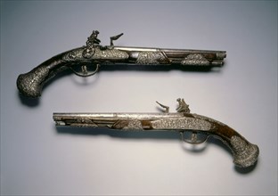 Pair of Flintlock Pistols, c. 1670. Italy, Brescia, 17th century. Steel, chiseled decoration with