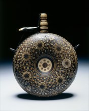 Powder Flask, c. 1620-1650. Germany, 17th century. Walnut inlaid with horn in concentric circles;