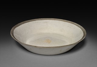 Saucer: Ding ware, 12th-13th Century. China, Jin dynasty (1115-1234) - Yuan dynasty (1271-1368).