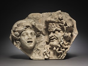 Two Masks, 200s. Italy, Roman, 3rd century. Marble; overall: 27.4 x 38.8 cm (10 13/16 x 15 1/4 in.)