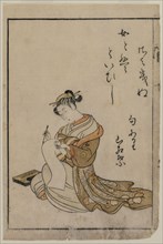 The Courtesan Writing from a Book (From A Collection of Beautiful Women of the Yoshiwara), 1770.