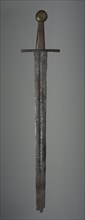 Sword, c. 1350. Germany (?), 14th century. Iron; wood grip and brass pommel replacements; overall: