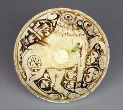 Bowl with Griffin, 1100s. Northwest Iran, Garrus district, Seljuk period, 12th century. Earthenware