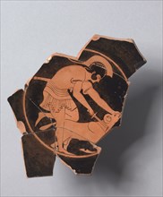 Fragment of a Kylix, c. 490-480 BC. Greece, Attic, 5th Century BC. Red-figure terracotta; diameter: