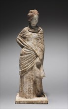 Female Figurine, 400-200 BC. Greece, Tanagra (Boeotia), 4th-3rd Century BC. Molded terracotta,