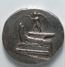Tetradrachm: Nike Blowing Trumpet, standing on war galley prow (obverse), c. 300-295 BC. Greece,