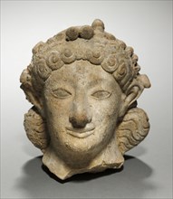 Head of Artemis, 600-575 BC. Greece, late 6th Century BC. Terracotta; overall: 13.8 cm (5 7/16 in.)