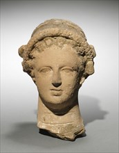 Head of a Woman, 400s BC. Greece, 5th Century BC. Terracotta; overall: 16.5 cm (6 1/2 in.).
