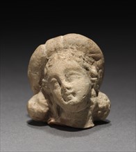 Head of a Goddess, 1-200. Parthian, 1st-2nd Century. Terracotta; overall: 2.6 cm (1 in.).