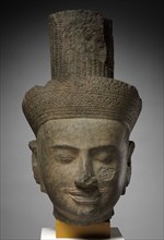 Head of Shiva, 1100s. Cambodia, Angkor, 12th century. Sandstone; with base: 42 cm (16 9/16 in.)