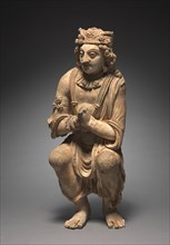 Adoring Attendant from a Buddhist Shrine, c. 300s-400s. Afghanistan, Gandhara, Kushan Period (1st