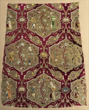 Brocaded velvet with falconer and attendant in animated lattice, from a robe, mid 1500s. Iran,