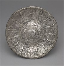 Dish with Tambourine Players, 700-600 BC. Phoenicia, 7th Century BC. Silver, partially gilt;