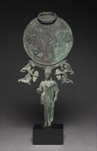 Mirror, c. 470-460 BC. Greece, Sicyon(?), 5th Century BC. Bronze; diameter: 15.3 cm (6 in.);