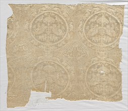 Silk fragment with confronted animal medallions and kufic bands, 1480-1649. Iran. Diasper, tabby