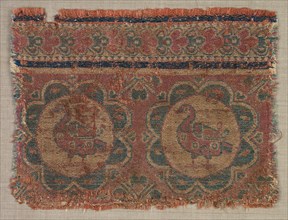 Silk fragment with roundels of ducks, 600s. Iran. Samite: silk; overall: 8.3 x 11.4 cm (3 1/4 x 4