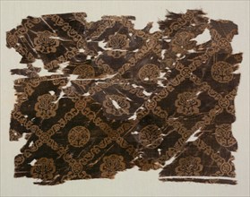 Silk with lattice of animals in medallions, 600s-800s. Egypt or Syria. Samite: silk; overall: 24.8