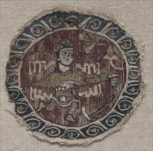 Roundel with figure, 1000s. Egypt, Fatimid period. Plain weave with inwoven tapestry weave: linen