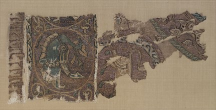 Embroidered border and field of animals in large roundels, 1000s-1100s. Iraq, probably Baghdad,