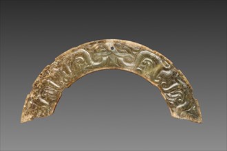 Pair of Arc-shaped Pendants with Animal Mask and Interlaced Animal Bands (Huang), 300-100 BC.