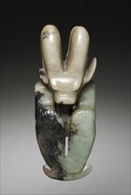 Amulet in the Form of a Seated Figure with Bovine Head, c. 4700-2920 BC. Northeast China, Neolithic