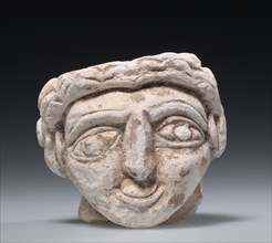 Female Head, 400s. Egypt, Coptic period, 5th Century. Limestone; overall: 9 x 10.2 cm (3 9/16 x 4
