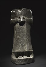 Statue of Gudea, c. 2143-2142 BC. Neo-Sumerian, Iraq, Girsu, 2143-2124 BC. Dolerite; overall: 126 x