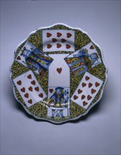 Plate with Playing Cards, c. 1760. France, Lille, 18th century. Faience; diameter: 25.4 cm (10 in.)